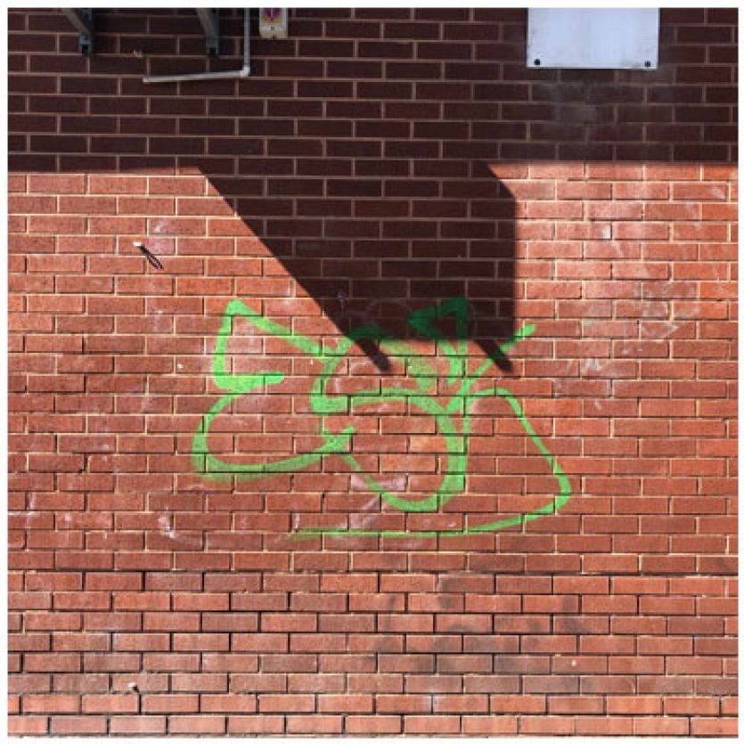 green graffiti on wall