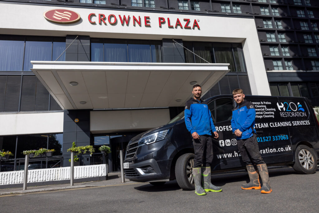 The H2O Restoration team stood outside the Crowne Plaza, ready to tackle anything.